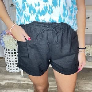 Black womens woven shorts. Side pocket and draw string. New